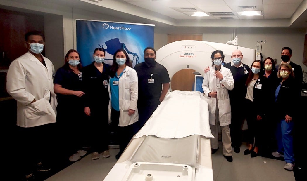 hospital staff standing around large Heartflow machine