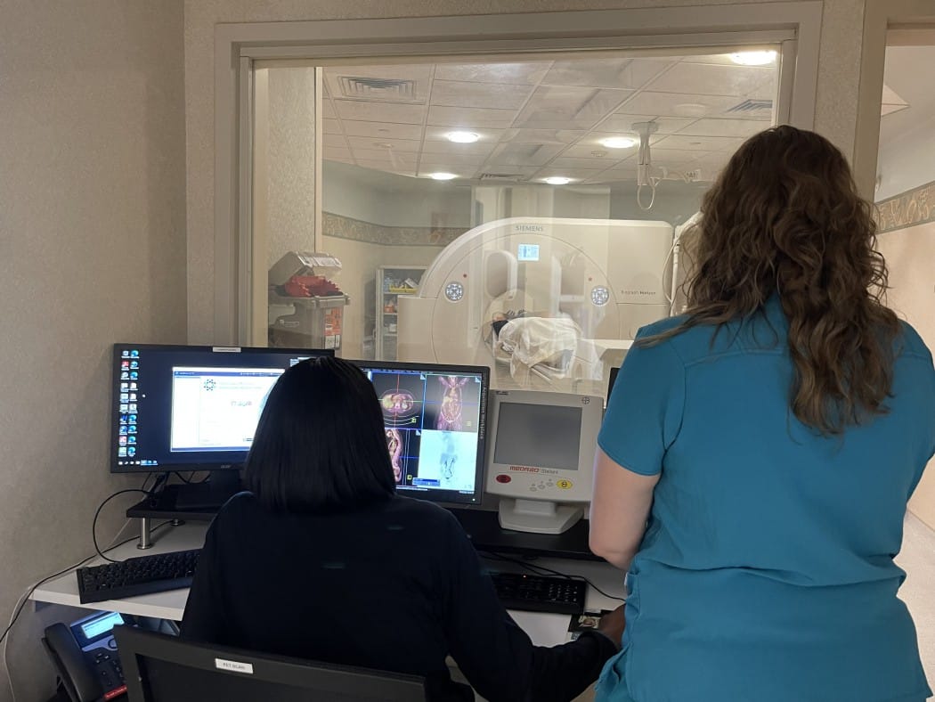 Radiologists at a computer